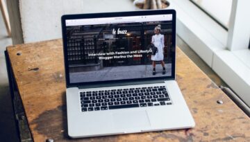 MacBook Pro on brown wooden table